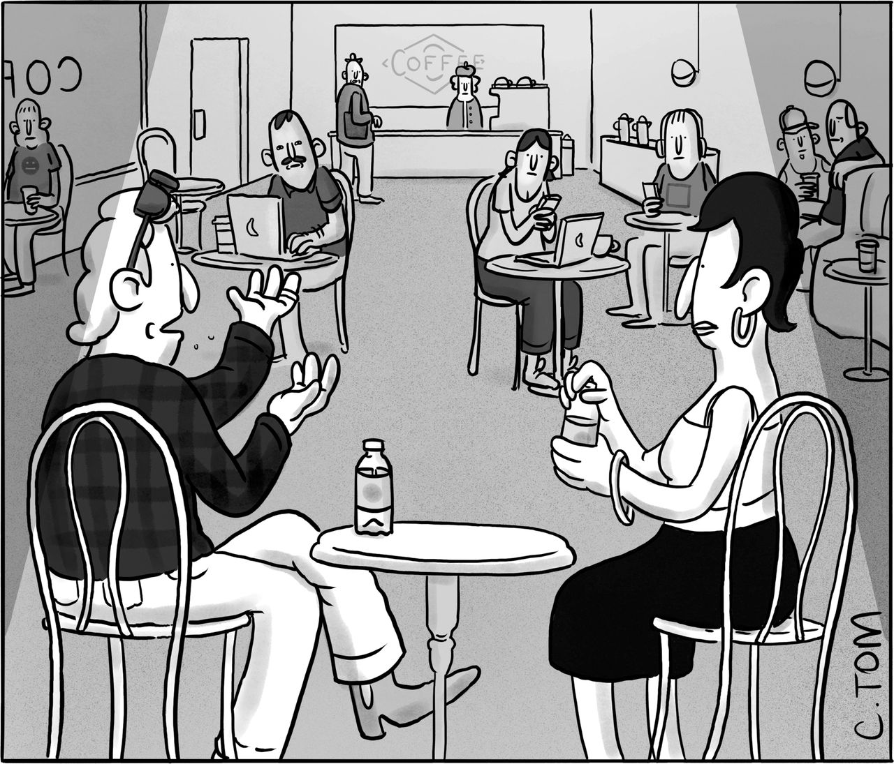 Man and woman talking in coffee shop.
